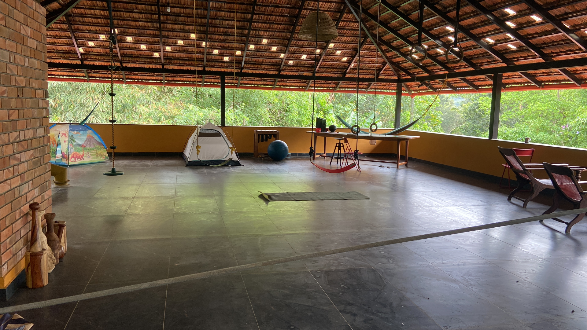 Open play area with swings, rings and hammocks