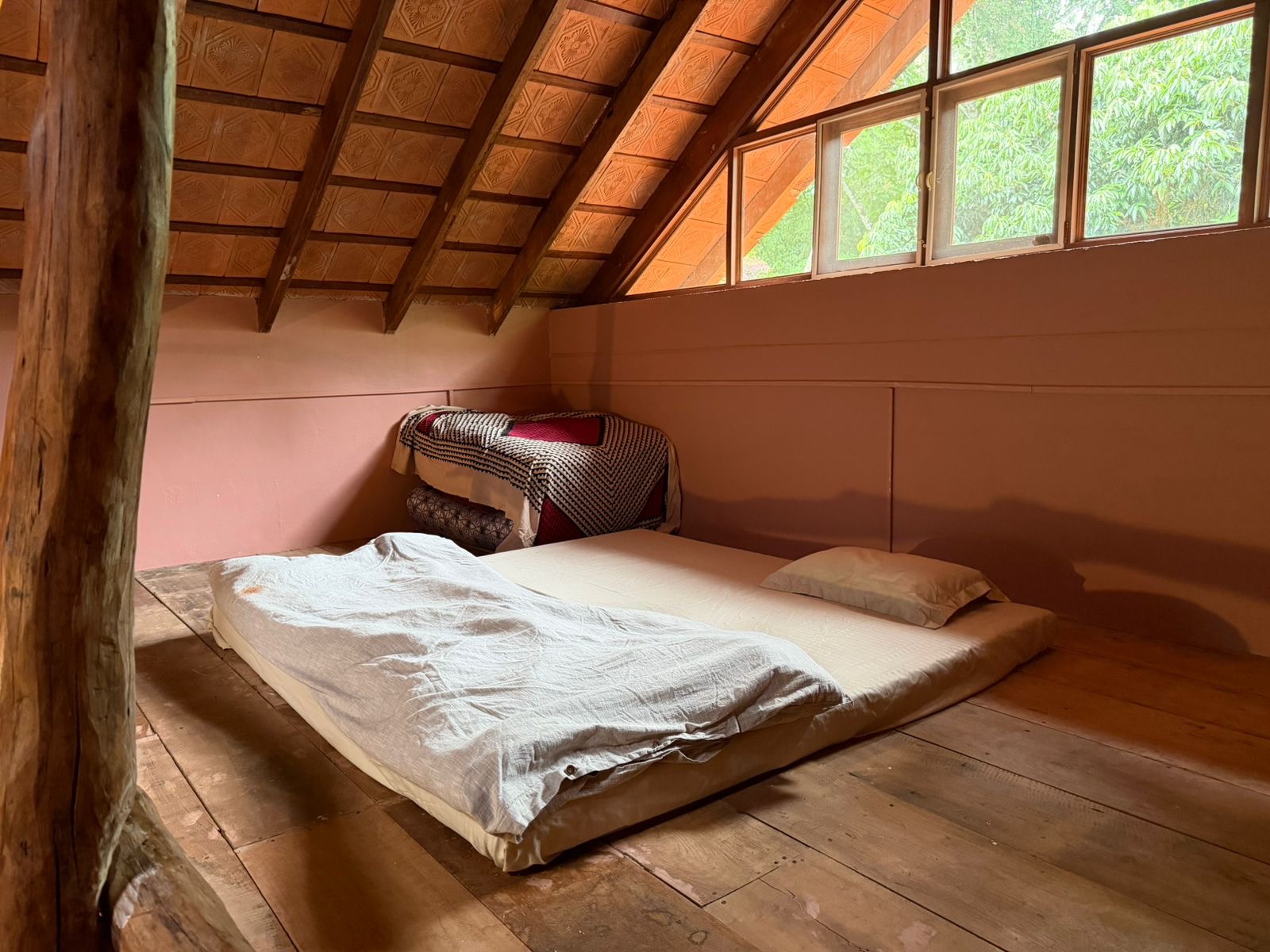Attic loft mattress under a pitched tiled roof