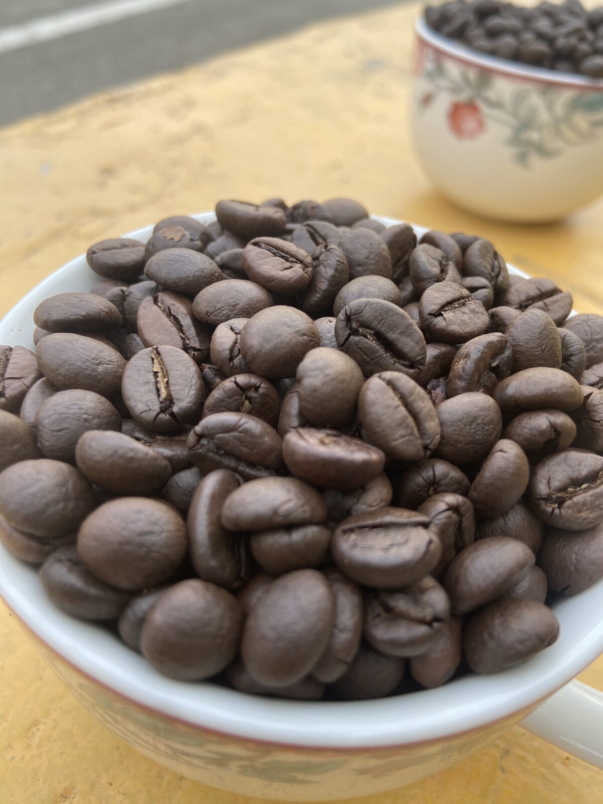 Freshly roasted Soms Coffee beans, deep brown and glossy